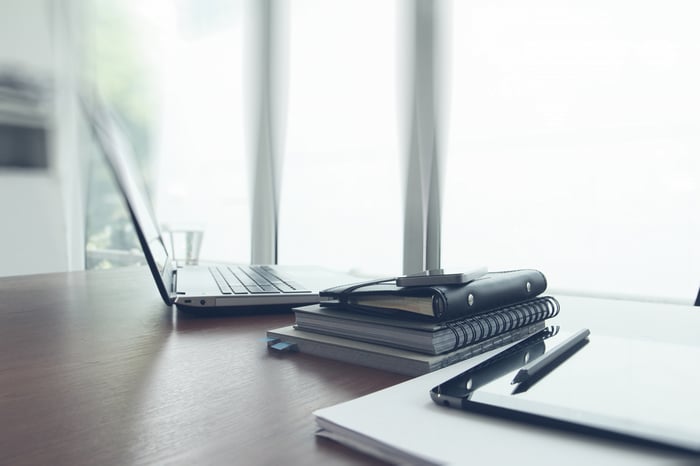 Photo of computer, books and glasses